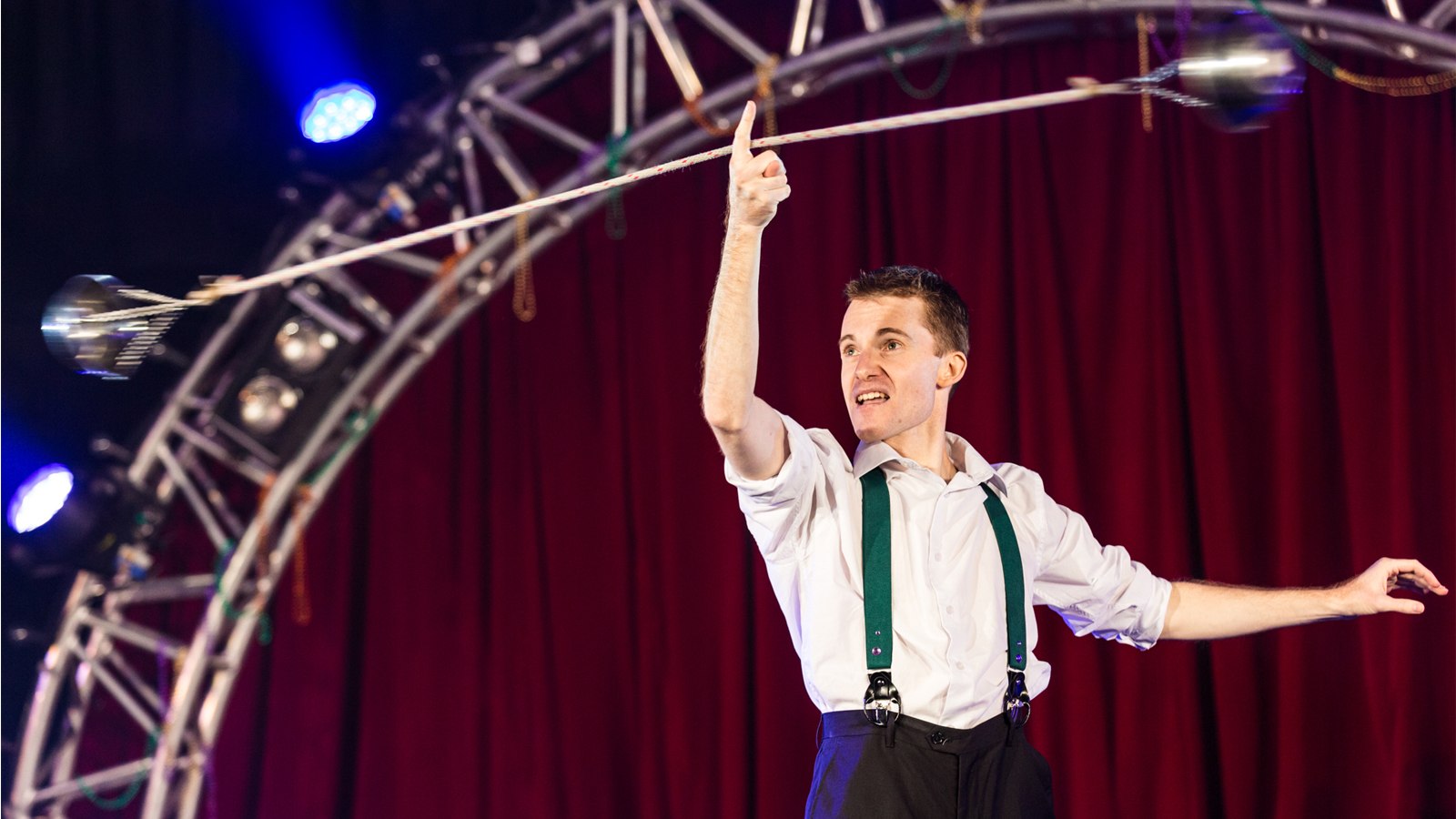 a circus performer juggling water filled bowls