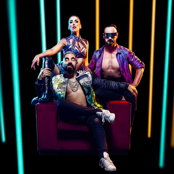 A group of cyberpunk acrobats sitting on a couch, flanked by LED tubes and futuristic lighting